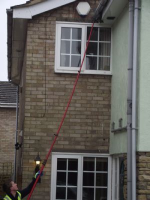 Me at work cleaning fascia using the Pure Water System
